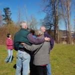 Dave Ramsay hugs attendees at a gathering recognizing his work in and for Kirkland Parks. Katie Metzger/staff photo