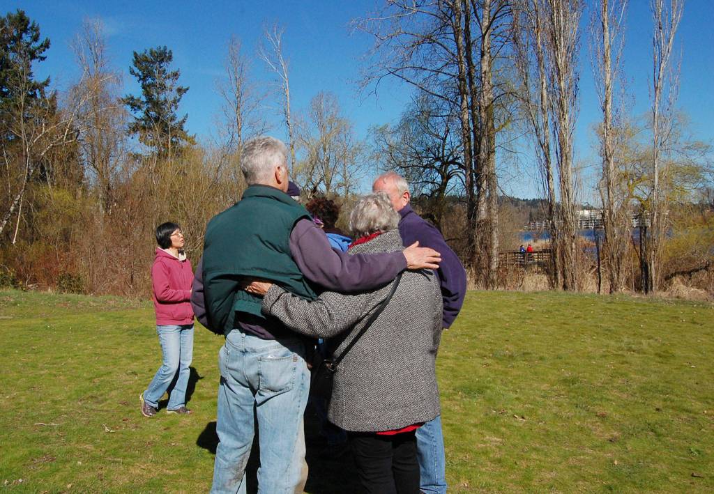 Dave Ramsay hugs attendees at a gathering recognizing his work in and for Kirkland Parks. Katie Metzger/staff photo