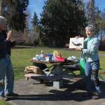 Kirkland parks advocate Nona Ganz gives former City Manager Dave Ramsay a plaque featuring a blackberry root, to commemorate his years of service to restore parkland. Katie Metzger/staff photo