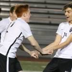 Lake Washington and Juanita soccer squads displaying teamwork, discipline