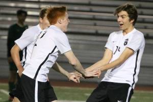 Lake Washington and Juanita soccer squads displaying teamwork, discipline