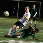 Lake Washingtons Conor Knox, left, battles Redmonds Takanubu Suzuki for the ball. Andy Nystrom/staff photo