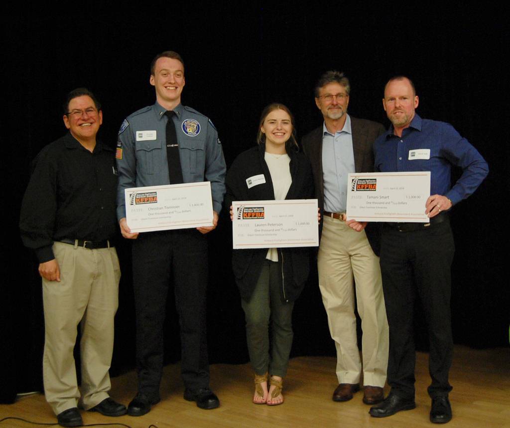 Eileen Trentman Youth Scholarship award winners Lauren Peterson and Christian Tomisser pose with Kirkland Deputy Mayor Jay Arnold (left), City Council member Tom Neir and Volunteer Services Coordinator Patrick Tefft. Katie Metzger/staff photo