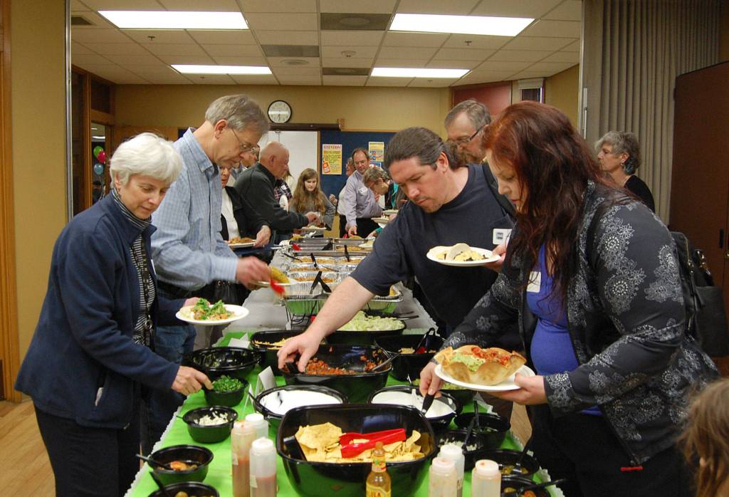 Volunteers mingle over a light dinner at last weeks Volunteer Appreciation Celebration. Katie Metzger/staff photo