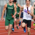 Lake Washingtons Xavier Betancourt (right) and Redmonds Kyle Bily race through the 4x100-relay on April 19. Andy Nystrom / staff photo