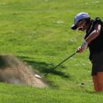Lake Washingtons Hayley Hopkins hits out of a bunker on the first hole on April 26 at Bellevue Golf Course. Andy Nystrom / staff photo