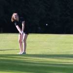 Lake Washingtons Grace Hawkins hits an approach shot on the ninth hole on April 26. Andy Nystrom / staff photo