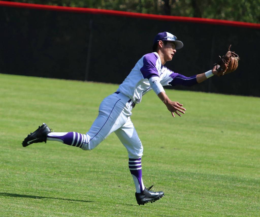 Kang second baseman I-Ly Hsue snags an out in the fourth inning. Andy Nystrom / staff photo