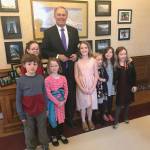 Local students Finn, Nora, Margaret, Lucia, Kaileigh, Megan and Becky meet with Gov. Jay Inslee, after some of them started a campaign to ban plastic bags. Photo courtesy of Angela Pifer