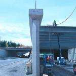Workers install girders as part of a previous project in 2012 along westbound SR 520. Reporter File Photo