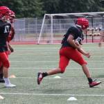 Romeon Greve runs the ball up field during practice on June 11. Andy Nystrom / staff photo