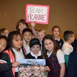 St. Madeleine Sophie Catholic School students surround gymnast Frannie Ronan, center, after she learned of her selection to compete at the 2018 Special Olympics USA Games. Courtesy photo