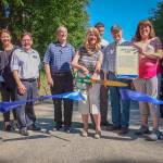 King County, Kirkland, and Bellevue representatives cut the ribbon on the new trail. From left: Kirkland City Council member Penny Sweet, Kirkland Mayor Amy Walen, Kirkland City Council member Jay Arnold, Bellevue Mayor John Chelminiak, former King County Council member Jane Hague, King County Parks Director Kevin Brown, Bellevue City Council member John Stokes, King County Council member Claudia Balducci and King County DNRP Director Christie True. Photo courtesy of Eli Brownell, King County Parks.