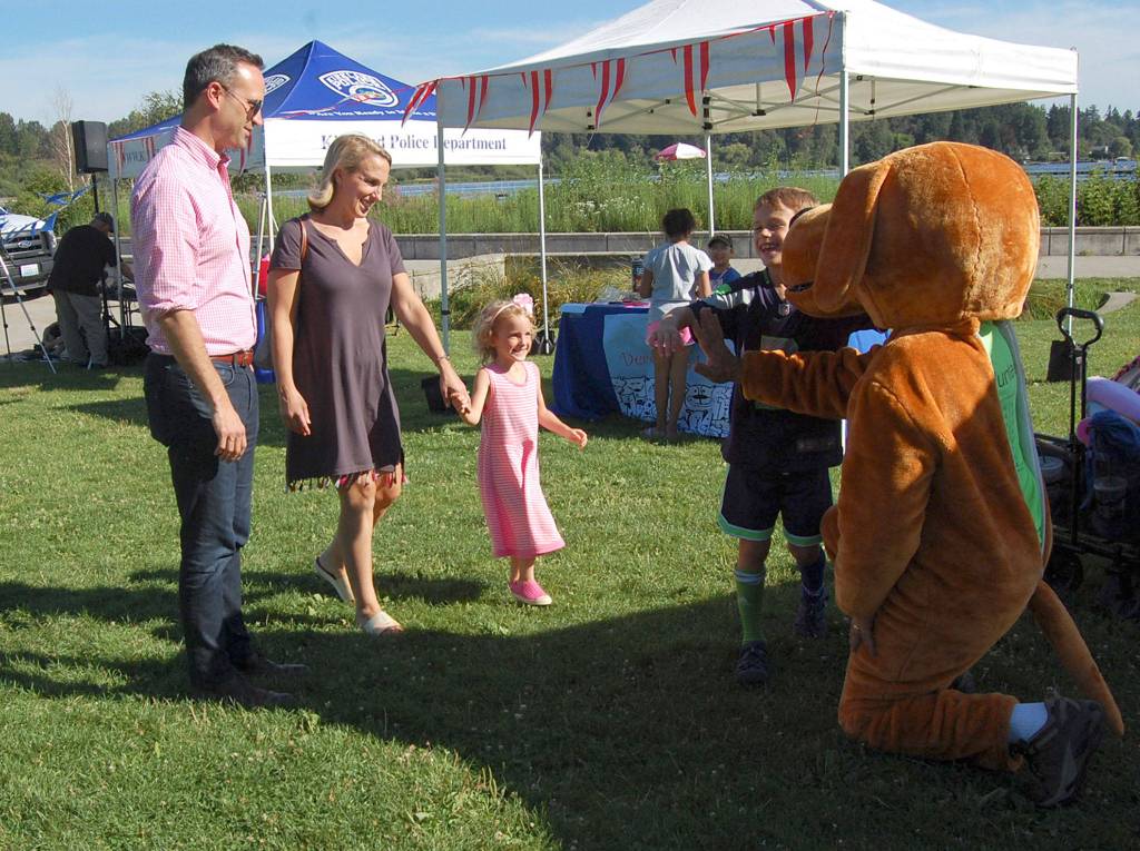 A dog mascot from Kirkland Green Trip meets a local family at Pet-a-Palooza. Katie Metzger/staff photo