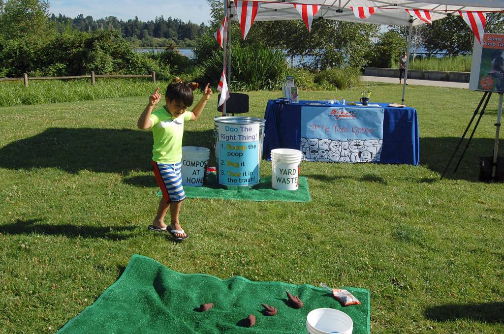 Dario Karameto, 6, plays a game meant to educate about pet waste at Kirklands Pet-a-Palooza. Katie Metzger/staff photo