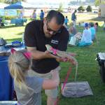 Ruby the bearded dragon meets vendors at Kirklands Pet-a-Palooza event on July 13. She later went on to win one of the cutest pet awards. Katie Metzger/staff photo