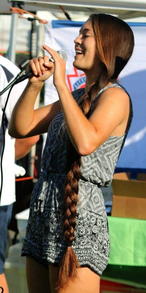 Former Kirkland Little League majors and juniors star Tori Bivens, who also led Lake Washington High to a state title and now plays at Boise State, spoke to the girls about teamwork. Andy Nystrom / staff photo