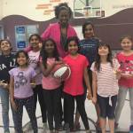 Val Whiting with one of her young girls basketball teams. Courtesy photo