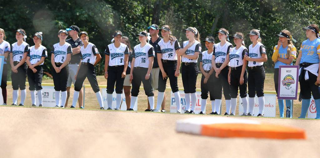 The host Redmond team soaks up the opening ceremonies in this shot from the first-base dugout. Andy Nystrom / staff photo