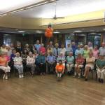 2018 Washington Instructor of the Year Gina Casanova smiles with students at the Peter Kirk Community Center. Photo courtesy of the city of Kirkland