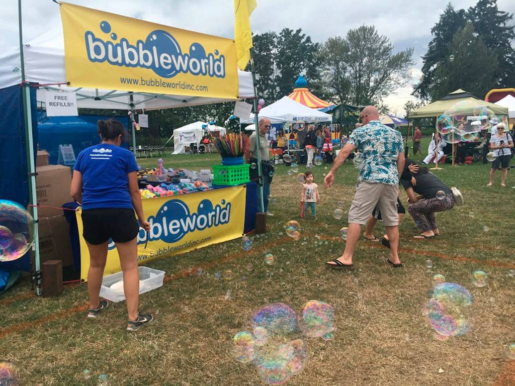 Families play with bubbles in the KidZone at Kirkland Summerfest on Aug. 11. Katie Metzger/staff photo