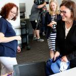Rep. Suzan DelBene hands out granola bars as a snack for parents who brought their children to the Kingsgate Library Summer Meals program. Kailan Manandic/staff Photo