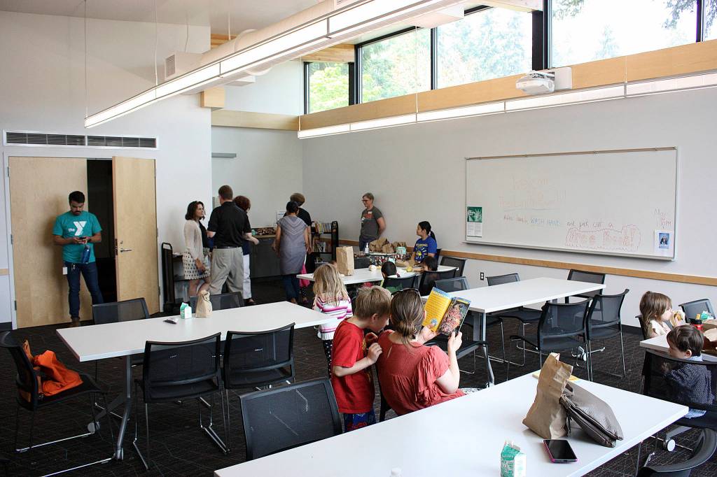 More than a dozen children came and went during Rep. Suzan DelBenes visit to the Kingsgate Library Summer Meals program. Kailan Manandic/staff Photo