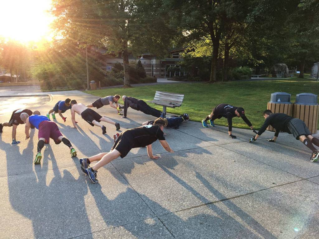 A group of F3 members perform Handslap Merkins as they wait for the other group to return from a run around the parking lot. Photo Courtesy of Brian Dilfer Gawthrop