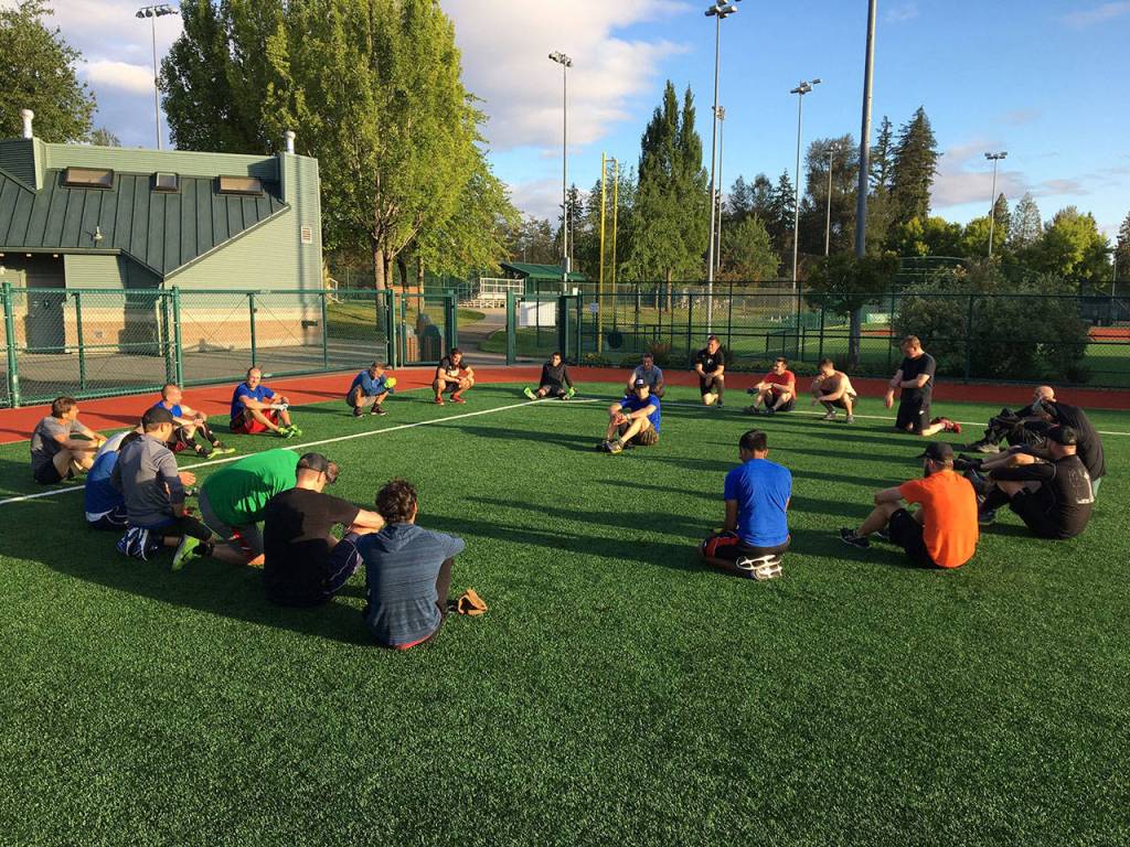 F3 members sit in the Circle of Trust after the Labor Day workout session. Jason AP Silverstein led the workout and is in the center of the circle sharing Words of Wisdom. Photo Courtesy of Brian Dilfer Gawthrop