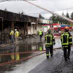 Kirkland firefighter patrol the aftermath of the Rose Hill Village fire, watching for hot spots and investigating the cause. Kailan Manandic/staff photo
