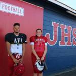 Juanita Highs Romeon Greve and Ruthie Childers get prepared to take the field for practice on Sept. 25. Andy Nystrom / staff photo