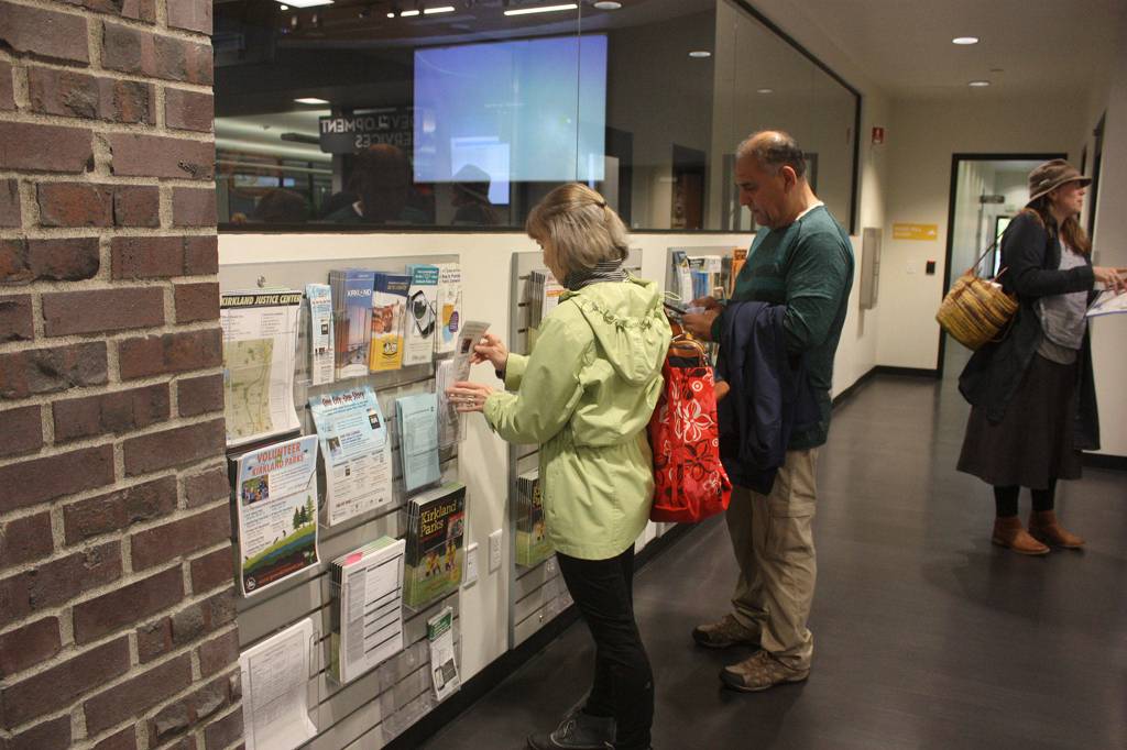 Residents peruse a selection of informational brochures at Kirklands City Hall for All. Katie Metzger/staff photo