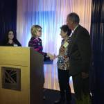 Lake Washington Institute of Technology President Dr. Amy Morrison Goings (center) honors Linda and Bob Tjossem, who started a scholarship fund for the school. Bob was presented with an honorary degree in welding. Samantha Pak/staff photo