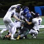 Lake Washington defenders wrap up a Shorewood runner. Photo courtesy of Shannon Soleil Rene