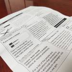 Early results: Carbon fee fails as gun control passes