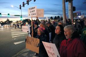 Protesters chant What do we want? Justice! When do we want it? Now! at the intersection of Northeast 124th Street and 124th Avenue Northeast Thursday evening. Kailan Manandic, staff photo
