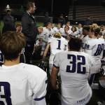 Lake Washington head coach Andy Arena, second from left, speaks with the Kangs following Friday nights loss. Andy Nystrom / staff photo