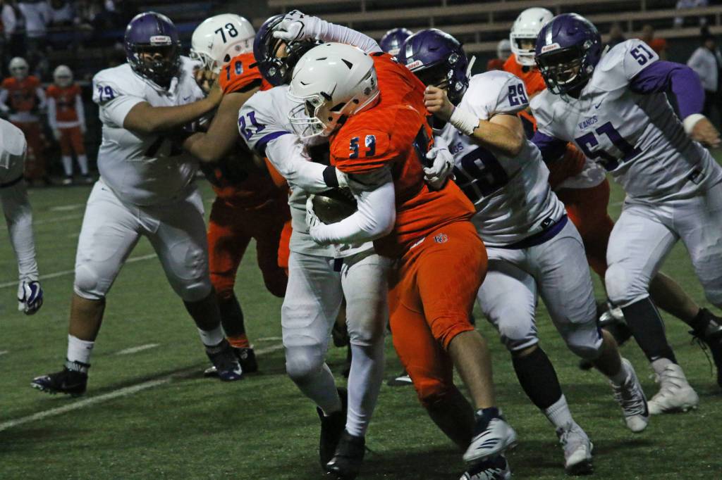 The Kang defense puts the clamps on an Eastside Catholic foe. Photo courtesy of Shannon Soleil Rene