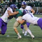 Lake Washingtons Levani Eneliko (51), Brady Gockel (7) and Zach Schuster (32) get the job done against Redmond. Photo courtesy of Shannon Soleil Rene