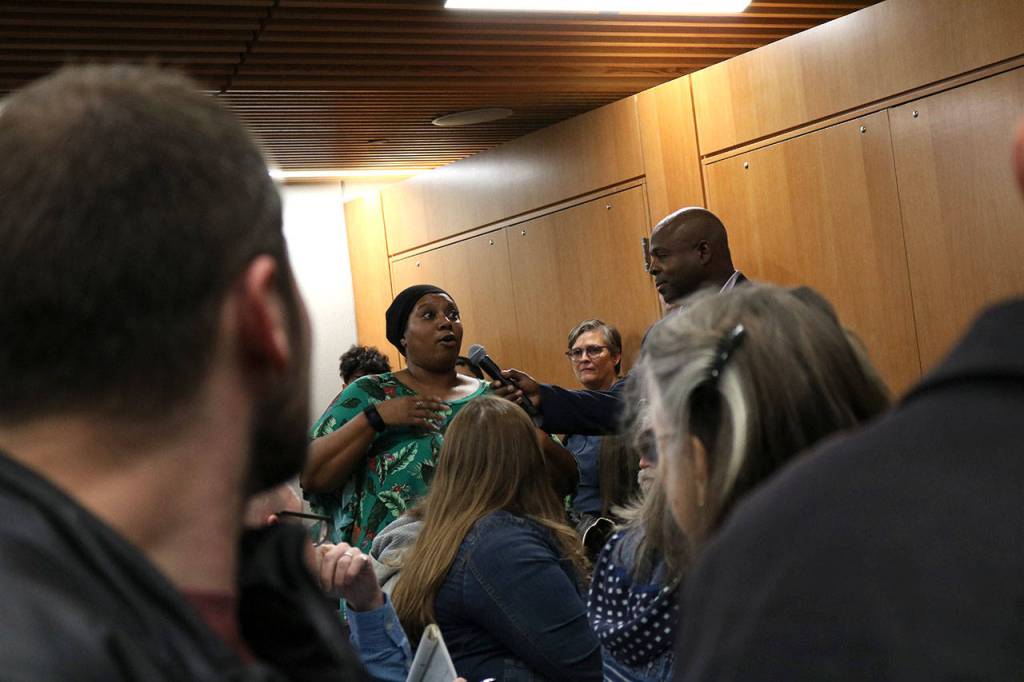 Community members state what they want to see changed as Kirkland moves forward from the Menchies incident. Other attendees would then hold up a number of fingers to indicate how much they agreed with the statement. Kailan Manandic, staff photo