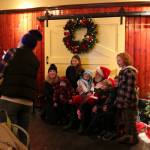 Members of the Bettes and Beecher families from Kirkland get their photo taken with Santa at the Wilde Rover during Winterfest on Dec. 1. Katie Metzger/staff photo
