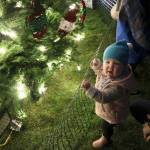 18-month-old Ellie Fischer from Kirkland enjoys the tree lighting at Kirklands Winterfest. Katie Metzger/staff photo