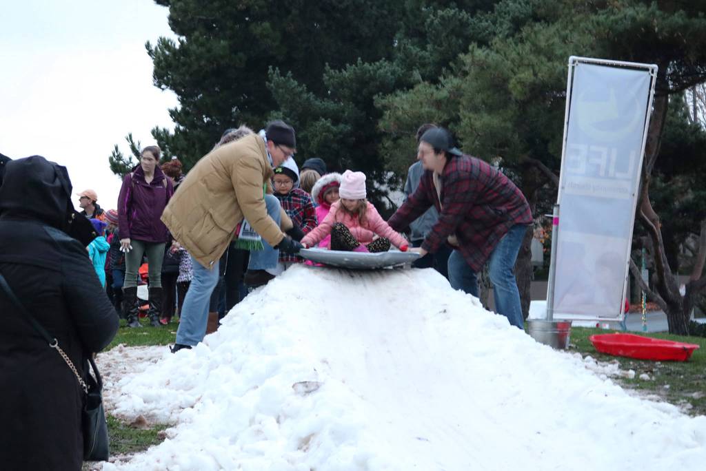 Kirklands Josefina Shore, 5, gets a push down the sledding hill at Kirklands Winterfest. The snow slide was sponsored by Life Community Church. Katie Metzger/staff photo