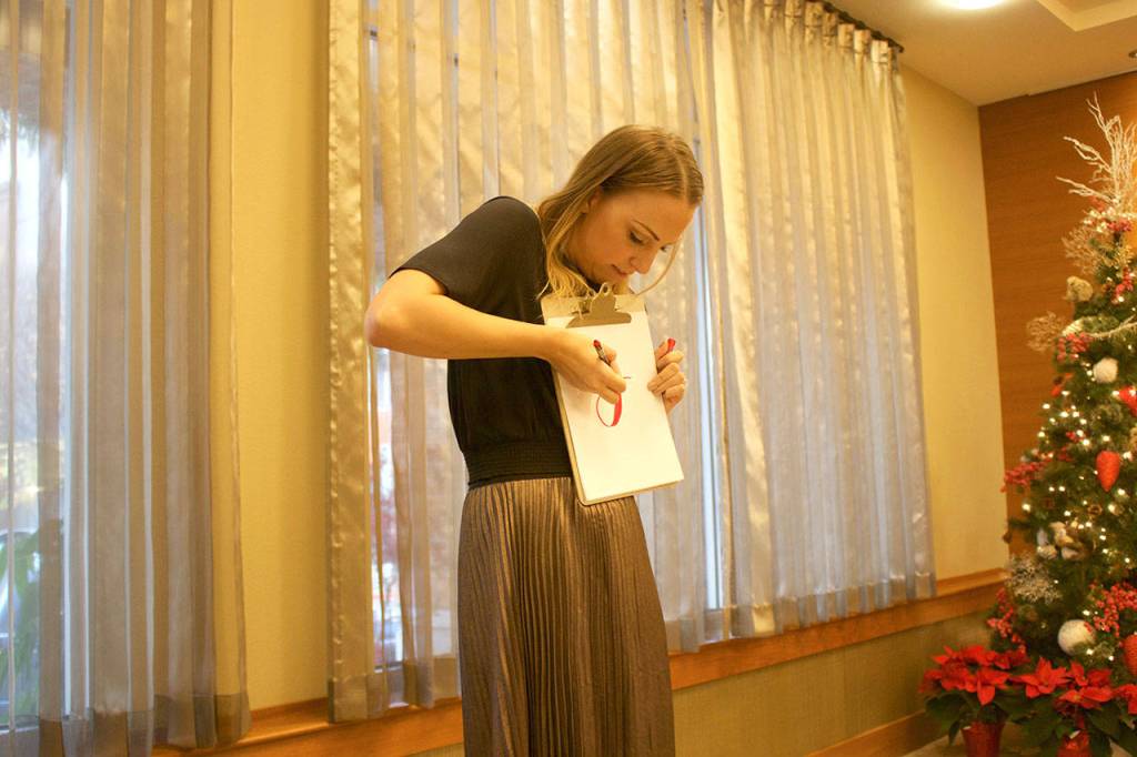 Camille Robinson shares tips and secrets to elevate personalized hand-lettered holiday cards. Stephanie Quiroz/staff photo