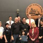 Joshua Reiss smiles with Dean Wilson and members of the Kirkland Fire Department and City Council on Dec. 11. Reiss helped saved Wilsons life over the summer by performing CPR on Wilson after he collapsed during a game of ultimate Frisbee. Photo courtesy of the city of Kirkland