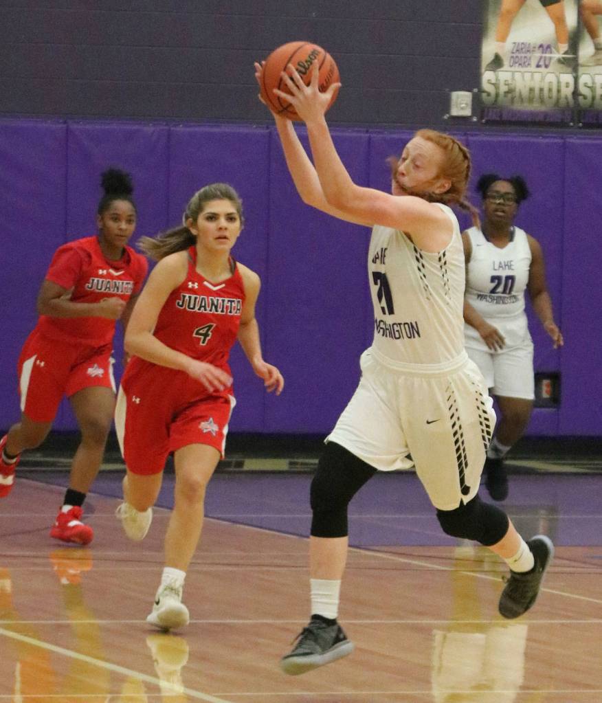 Lake Washingtons Jen Estes grabs and turns the ball toward the hoop. Andy Nystrom / staff photo