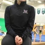Lake Washington senior gymnast Joeli Pence sits on the beam before a Jan. 17 meet at Woodinville High. Andy Nystrom / staff photo