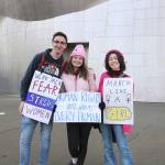 From left, Woodinville residents Miles Vernasco, Kendra Housough, and Lily Pilewood attended the Womxns March on Jan. 19.