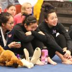 From left, Juanita Highs Gloria Wang and Lake Washington Highs Courteney Hori and Peyton Yoshida crack up during the awards ceremony at the 1A/2A/3A state gymnastics championships on Feb. 22 at Sammamish High. Andy Nystrom / staff photo