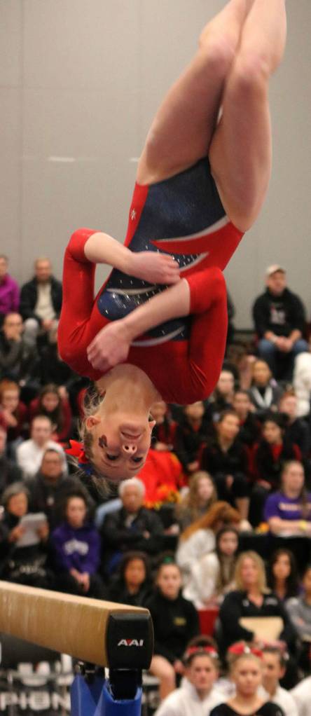 Juanitas Allison Lofquist gets her flips on beam. Andy Nystrom / staff photo